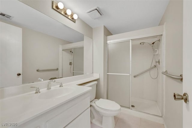 3746 E Harmon Ave, Las Vegas, NV 89121 - bathroom featuring vanity, a shower stall, and tile patterned floors