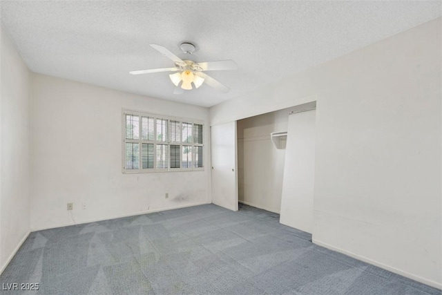 3746 E Harmon Ave, Las Vegas, NV 89121 - unfurnished bedroom with carpet floors, a textured ceiling, a closet, and a ceiling fan