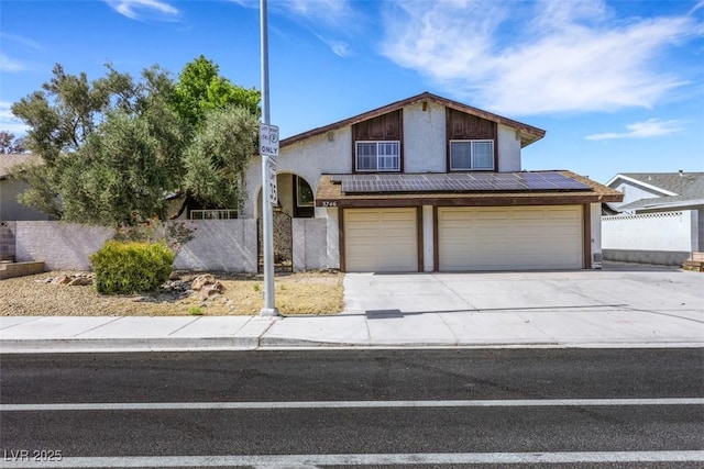 3746 E Harmon Ave, Las Vegas, NV 89121 - view of front of home with a garage, driveway, and stucco siding