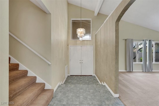 3746 E Harmon Ave, Las Vegas, NV 89121 - foyer with arched walkways, a chandelier, stairs, and high vaulted ceiling