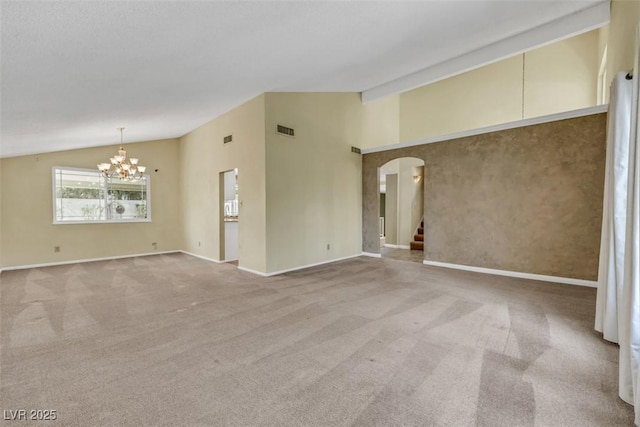 3746 E Harmon Ave, Las Vegas, NV 89121 - empty room featuring lofted ceiling, arched walkways, a chandelier, light colored carpet, and stairway