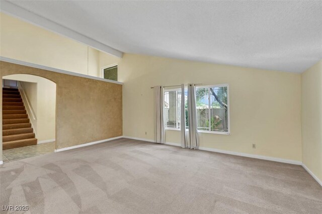 3746 E Harmon Ave, Las Vegas, NV 89121 - empty room with carpet flooring and stairway