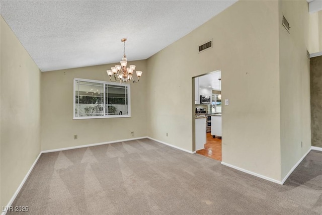 3746 E Harmon Ave, Las Vegas, NV 89121 - spare room with carpet, a chandelier, vaulted ceiling, and a textured ceiling