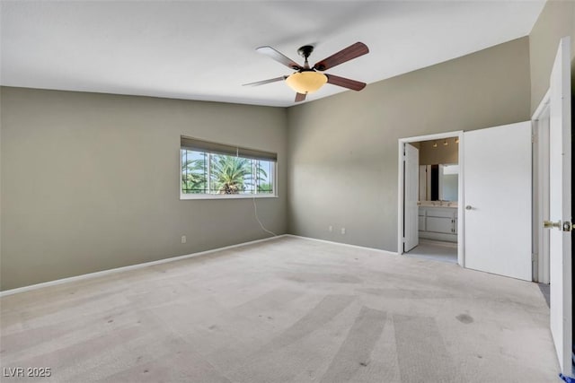 3746 E Harmon Ave, Las Vegas, NV 89121 - unfurnished bedroom with carpet, vaulted ceiling, ensuite bath, and a ceiling fan