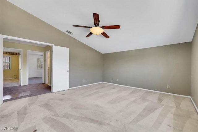 3746 E Harmon Ave, Las Vegas, NV 89121 - spare room with light colored carpet, lofted ceiling, and ceiling fan