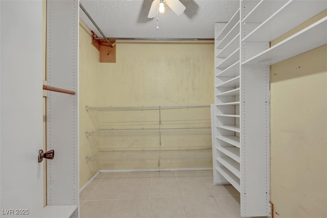 3746 E Harmon Ave, Las Vegas, NV 89121 - spacious closet with tile patterned floors and a ceiling fan