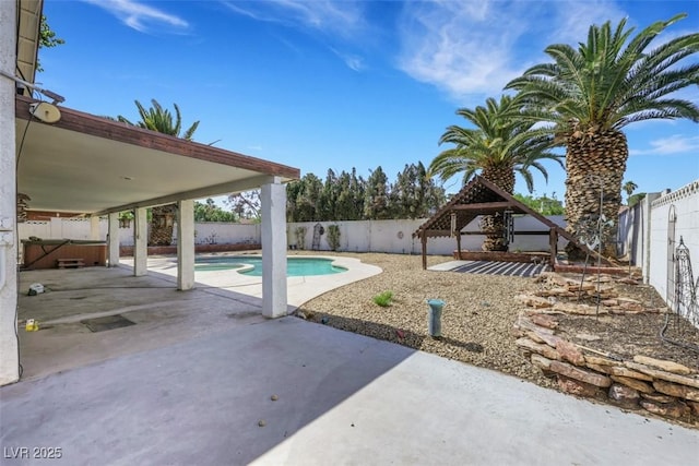 3746 E Harmon Ave, Las Vegas, NV 89121 - view of swimming pool with a patio area, a gazebo, a fenced backyard, and a covered hot tub