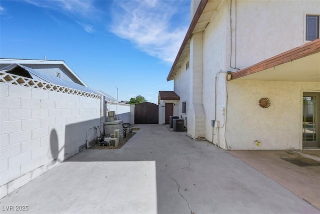 3746 E Harmon Ave, Las Vegas, NV 89121 - fenced backyard with a patio area and a gate