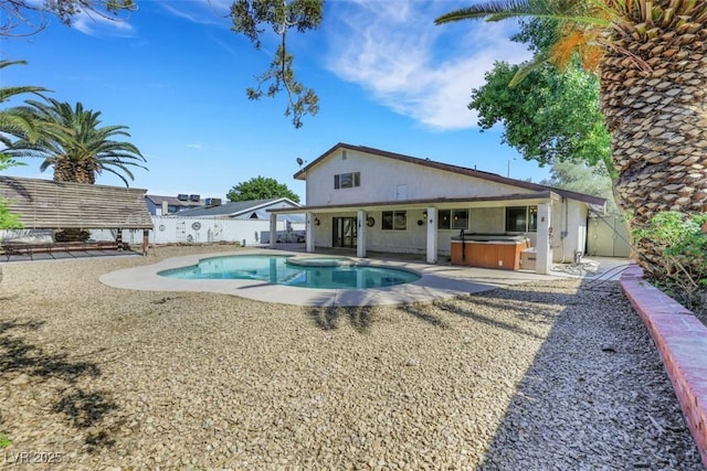 3746 E Harmon Ave, Las Vegas, NV 89121 - view of swimming pool featuring a hot tub, a fenced backyard, and a patio