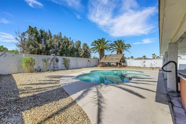 3746 E Harmon Ave, Las Vegas, NV 89121 - view of pool with a fenced backyard, a patio area, and a pool with connected hot tub