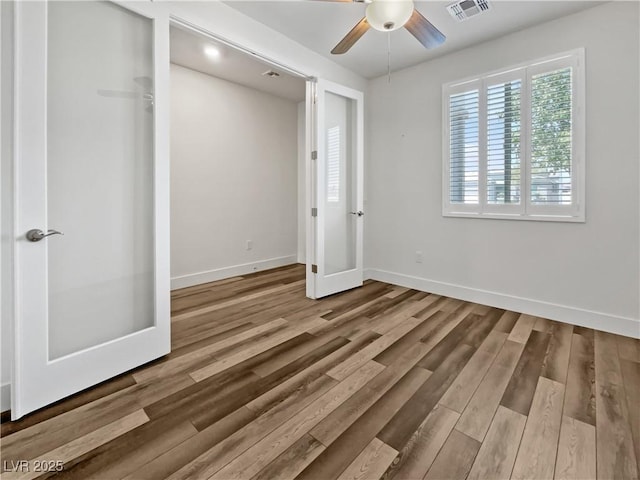 6312 Conlon St, North Las Vegas, NV 89081 - unfurnished bedroom with wood finished floors and baseboards