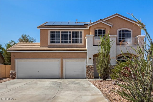 1798 Lakewood Dr, Henderson, NV 89012 - view of front of home featuring roof mounted solar panels, driveway, stucco siding, an attached garage, and a tiled roof