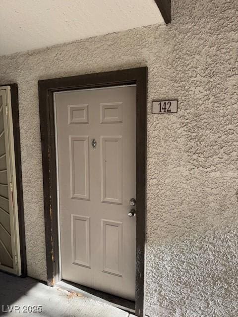 2606 S Durango Dr Unit 142, Las Vegas, NV 89117 - view of exterior entry featuring stucco siding