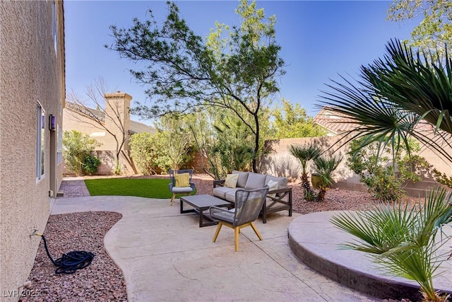 3420 Lockport St, Las Vegas, NV 89129 - fenced backyard with a patio area and an outdoor hangout area