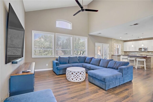 3420 Lockport St, Las Vegas, NV 89129 - living area featuring dark wood-type flooring, high vaulted ceiling, and ceiling fan