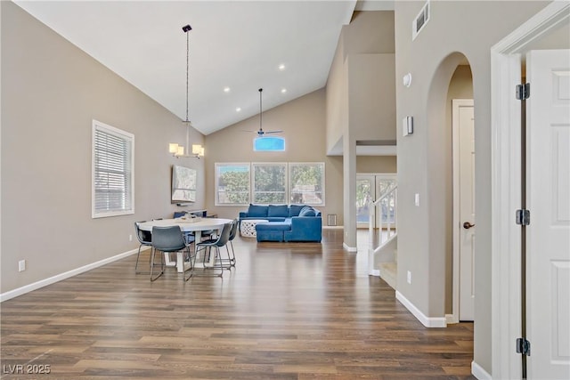 3420 Lockport St, Las Vegas, NV 89129 - dining space with wood finished floors, high vaulted ceiling, arched walkways, recessed lighting, and a chandelier
