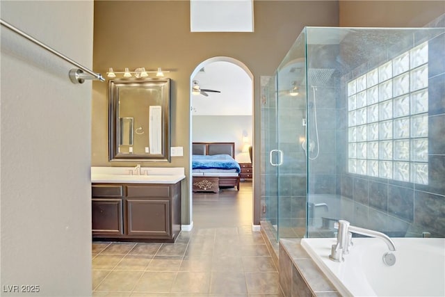3420 Lockport St, Las Vegas, NV 89129 - bathroom featuring vanity, a garden tub, a shower stall, tile patterned flooring, and connected bathroom