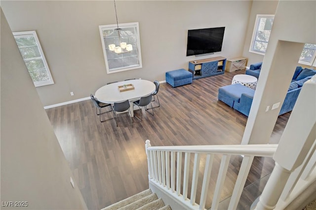 3420 Lockport St, Las Vegas, NV 89129 - stairs featuring wood finished floors and a chandelier
