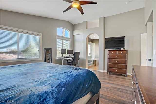 3420 Lockport St, Las Vegas, NV 89129 - bedroom with arched walkways, dark wood-type flooring, lofted ceiling, ensuite bath, and ceiling fan