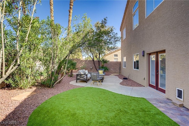 3420 Lockport St, Las Vegas, NV 89129 - fenced backyard featuring a patio and an outdoor hangout area