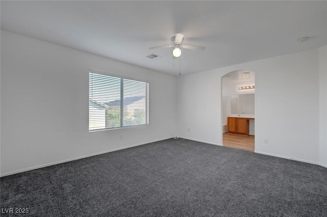 4751 Lone Grove Dr, Las Vegas, NV 89139 - empty room featuring carpet floors, ceiling fan, and arched walkways