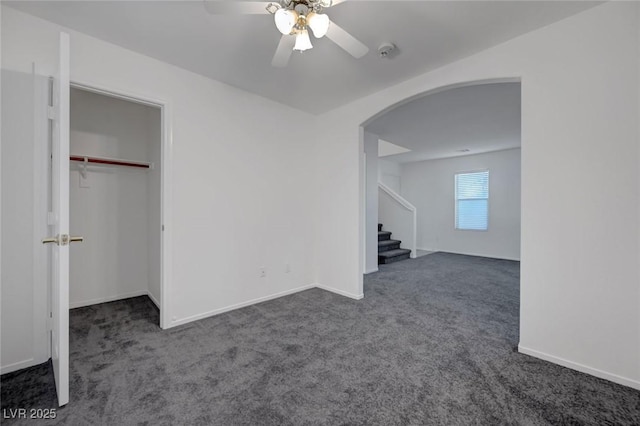 4751 Lone Grove Dr, Las Vegas, NV 89139 - interior space with arched walkways, dark colored carpet, a ceiling fan, and a closet