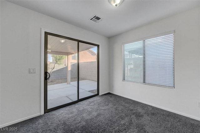 4751 Lone Grove Dr, Las Vegas, NV 89139 - spare room featuring dark colored carpet and baseboards