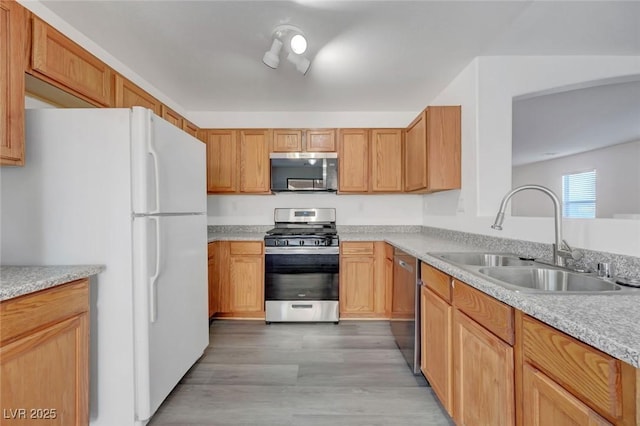 4751 Lone Grove Dr, Las Vegas, NV 89139 - kitchen featuring appliances with stainless steel finishes, light countertops, and light wood-style flooring