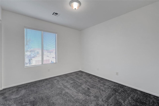 4751 Lone Grove Dr, Las Vegas, NV 89139 - unfurnished room with dark carpet and baseboards