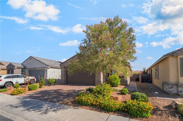 3782 Neblina Dr, Henderson, NV 89052 - view of front of house featuring driveway, a garage, and stucco siding