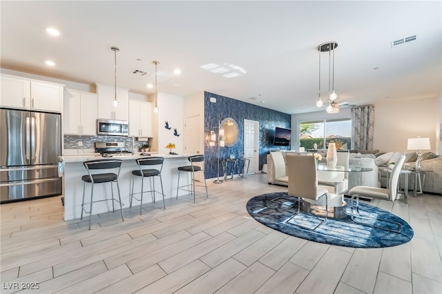 3782 Neblina Dr, Henderson, NV 89052 - dining room with light wood-type flooring and recessed lighting