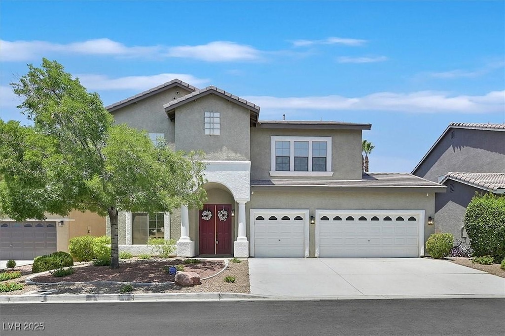 10673 Bonchester Hill St, Las Vegas, NV 89141 - traditional-style home with driveway, stucco siding, and a garage