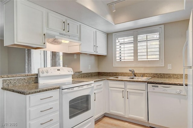 7300 Pirates Cove Rd Unit 1032, Las Vegas, NV 89145 - kitchen with white appliances, under cabinet range hood, white cabinetry, and track lighting