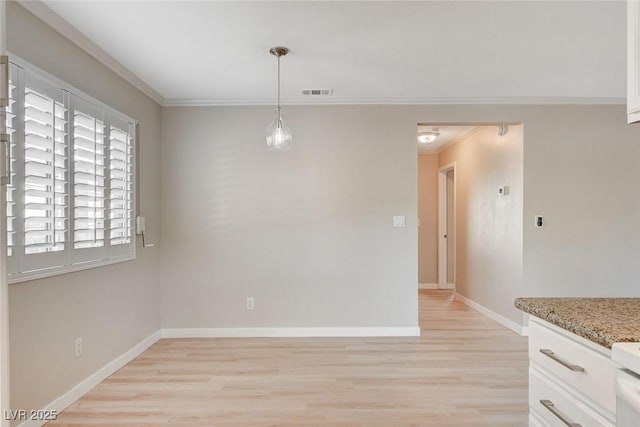 7300 Pirates Cove Rd Unit 1032, Las Vegas, NV 89145 - unfurnished dining area with crown molding and light wood-style floors