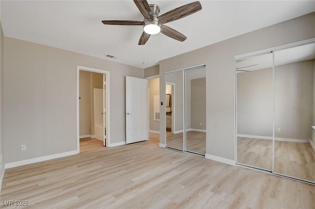 7300 Pirates Cove Rd Unit 1032, Las Vegas, NV 89145 - unfurnished bedroom with multiple closets, light wood finished floors, and a ceiling fan