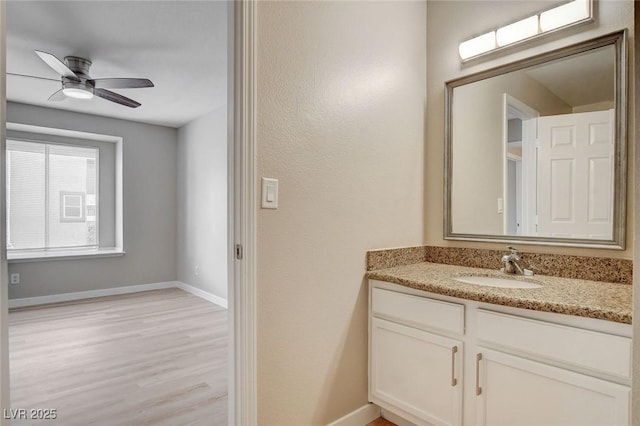 7300 Pirates Cove Rd Unit 1032, Las Vegas, NV 89145 - bathroom featuring vanity, wood finished floors, and a ceiling fan