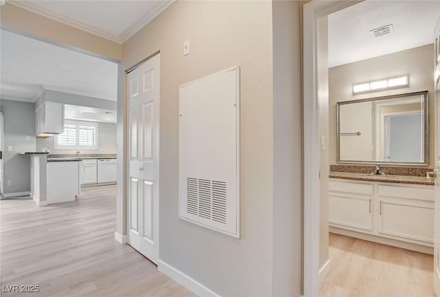 7300 Pirates Cove Rd Unit 1032, Las Vegas, NV 89145 - hallway featuring light wood finished floors and ornamental molding