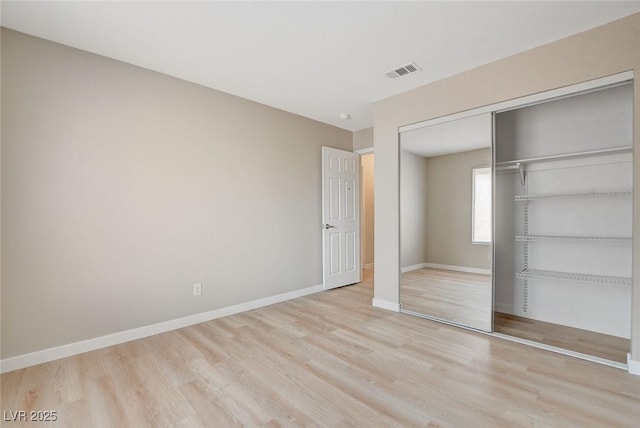 7300 Pirates Cove Rd Unit 1032, Las Vegas, NV 89145 - unfurnished bedroom featuring wood finished floors and a closet