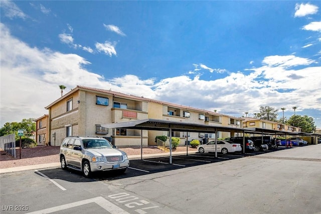 7300 Pirates Cove Rd Unit 1032, Las Vegas, NV 89145 - covered parking lot featuring a residential view