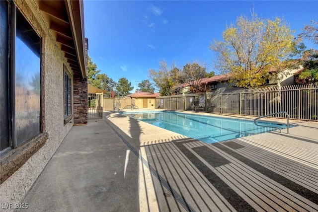 7300 Pirates Cove Rd Unit 1032, Las Vegas, NV 89145 - community pool featuring a patio and a fenced backyard
