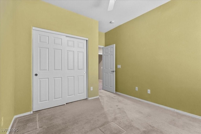9233 Onyx Point Ct, Henderson, NV 89074 - unfurnished bedroom with carpet flooring, a closet, and a ceiling fan