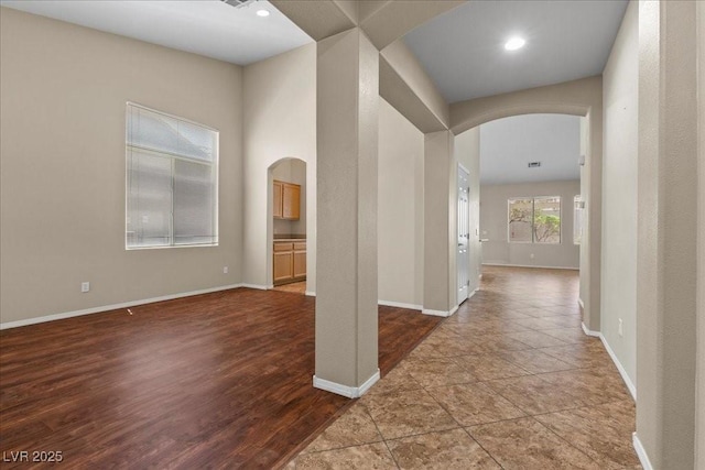 9233 Onyx Point Ct, Henderson, NV 89074 - corridor featuring arched walkways, dark wood-type flooring, and recessed lighting
