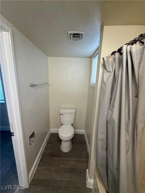 4941 Newport Cove Dr Unit B, Las Vegas, NV 89119 - full bath with wood finished floors and curtained shower