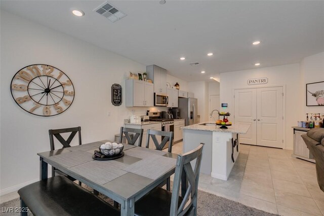 10939 Cheshire Woods Ave, Las Vegas, NV 89166 - dining area featuring recessed lighting and light tile patterned floors
