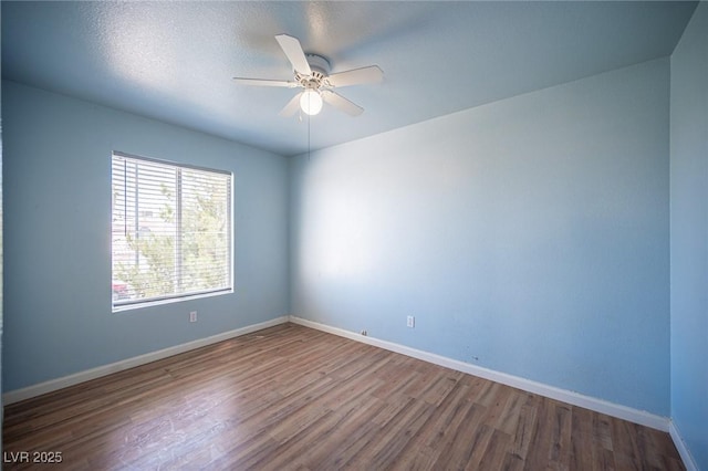 6524 Rain Forest Dr, Las Vegas, NV 89108 - empty room with wood finished floors and a ceiling fan