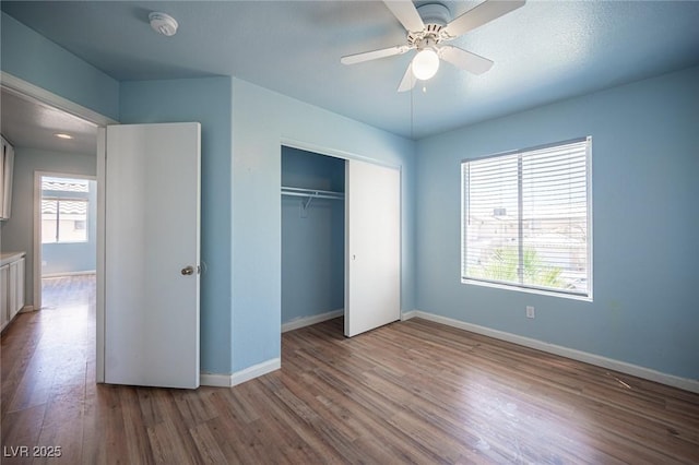 6524 Rain Forest Dr, Las Vegas, NV 89108 - unfurnished bedroom featuring wood finished floors, a closet, and a ceiling fan