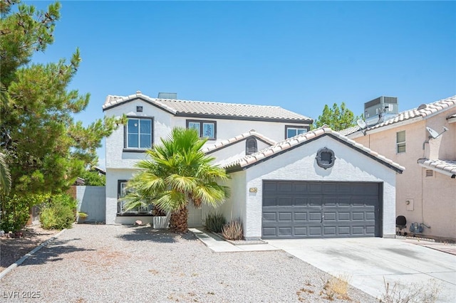 6524 Rain Forest Dr, Las Vegas, NV 89108 - view of front facade featuring concrete driveway, stucco siding, a garage, and a tiled roof