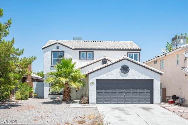 6524 Rain Forest Dr, Las Vegas, NV 89108 - mediterranean / spanish-style house with concrete driveway, stucco siding, a garage, and a tile roof