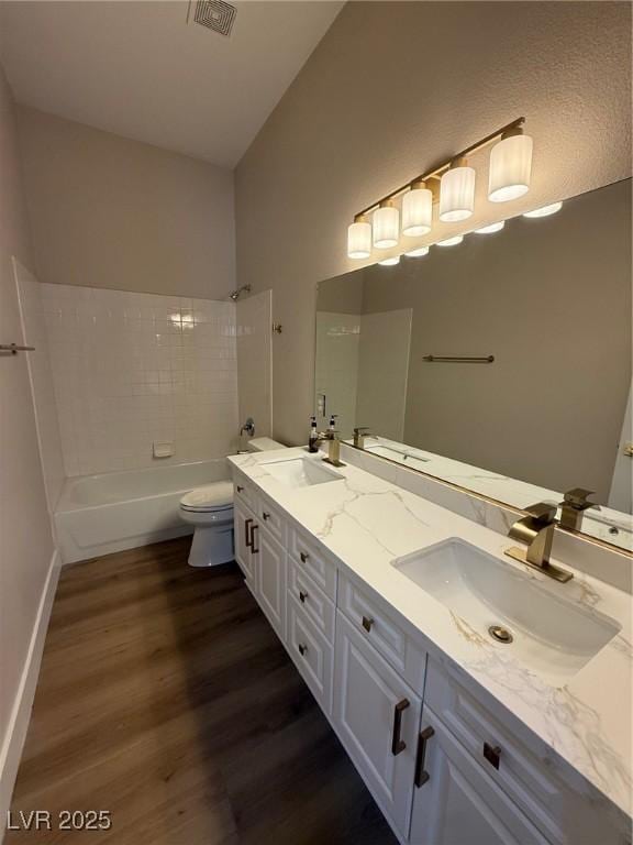 379 Marlin Cove Rd, Henderson, NV 89012 - bathroom with wood finished floors, double vanity, and tub / shower combination