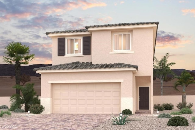 8526 W Agate Ave, Las Vegas, NV 89113 - mediterranean / spanish-style house with an attached garage, driveway, and stucco siding
